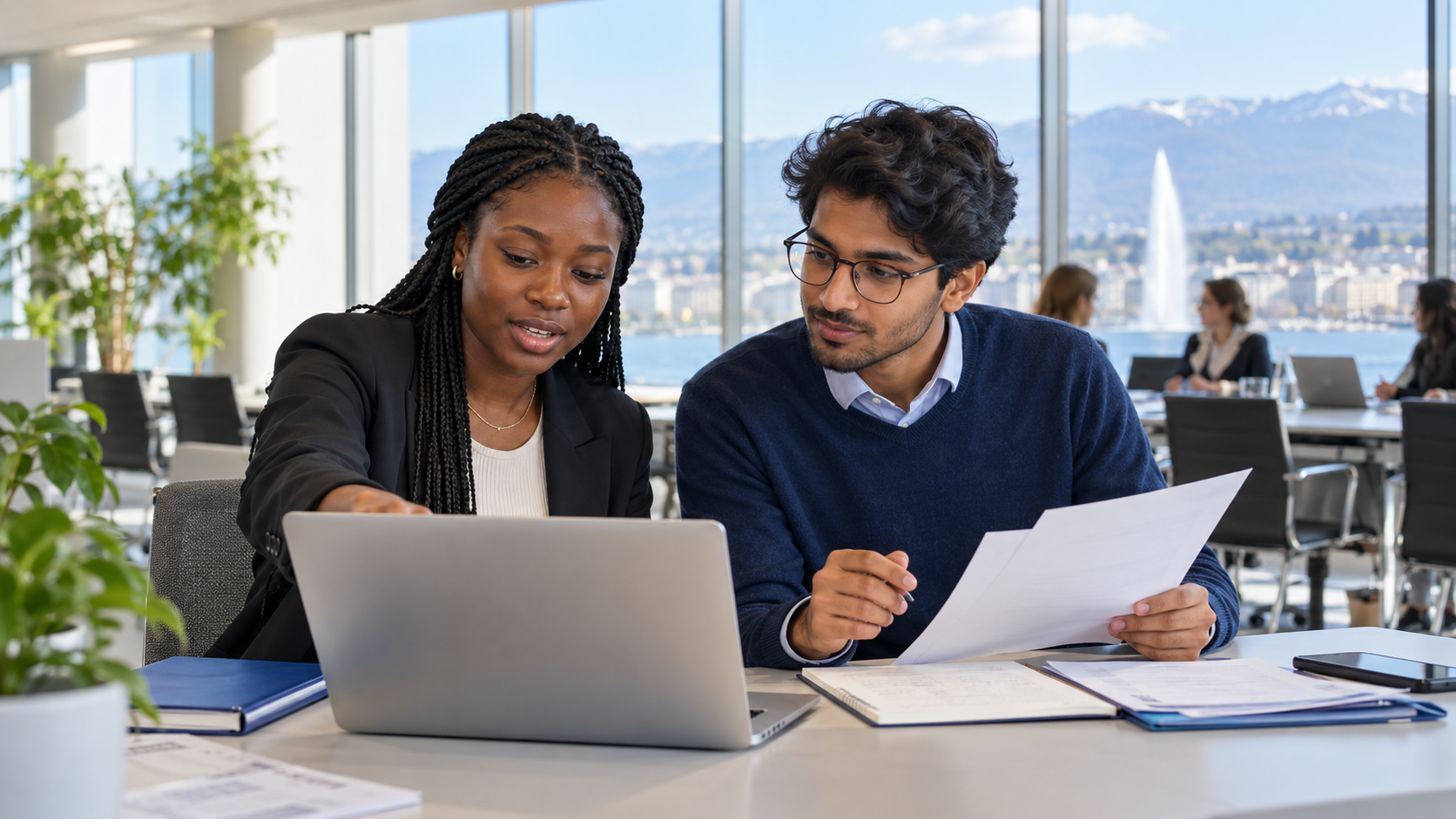 Nigerian and Indian early-career professionals collaborating in an international office